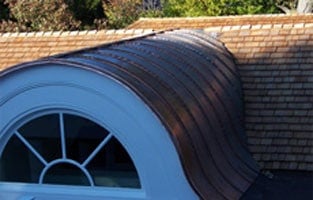 All Copper Standing Seam Half-Round Dormer Barrel Roof
